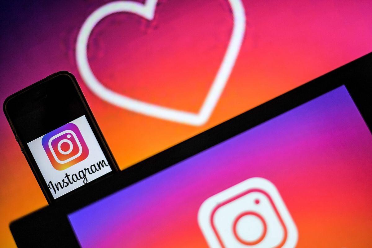 In this file photo taken on 2 May, 2019, logos of US social network Instagram are displayed on the screen of a computer and a smartphone in Nantes, western France. Photo: AFP