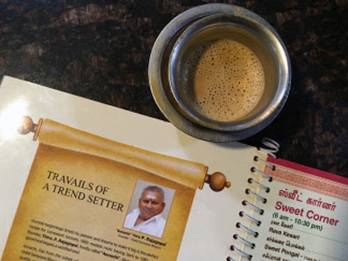This file photo taken on 28 June 2019 shows the image of P Rajagopal, founder of the Saravana Bhavan food chain, on a menu at one of the popular restaurants in Chennai. The founder of a trailblazing Indian restaurant chain dubbed the `dosa king` appealed 8 July to the Supreme Court for more time before beginning his life sentence for murder, citing ill health. Photo: AFP