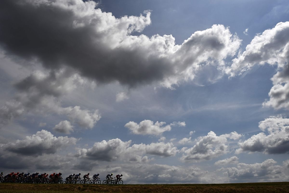 Cyclists ride in the countryside during the third stage of the 106th edition of the Tour de France cycling race between Binche and Epernay, Belgium, on 8 July, 2019. Photo: AFP