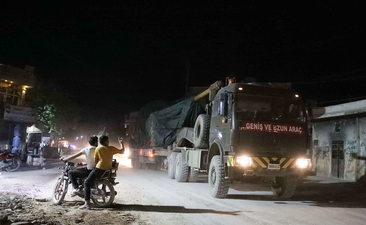 A convoy of Turkish military vehicles heading toward the northern Syrian Idlib province passes through the town of Atareb in Syria`s northwestern Aleppo province late during the night, on 7 July 2019. Photo: AFP