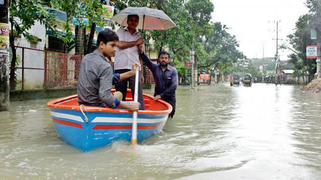 Tax official riding a boat to reach their office in Chittagong’s Agrabad. Photo: Jewel Shil