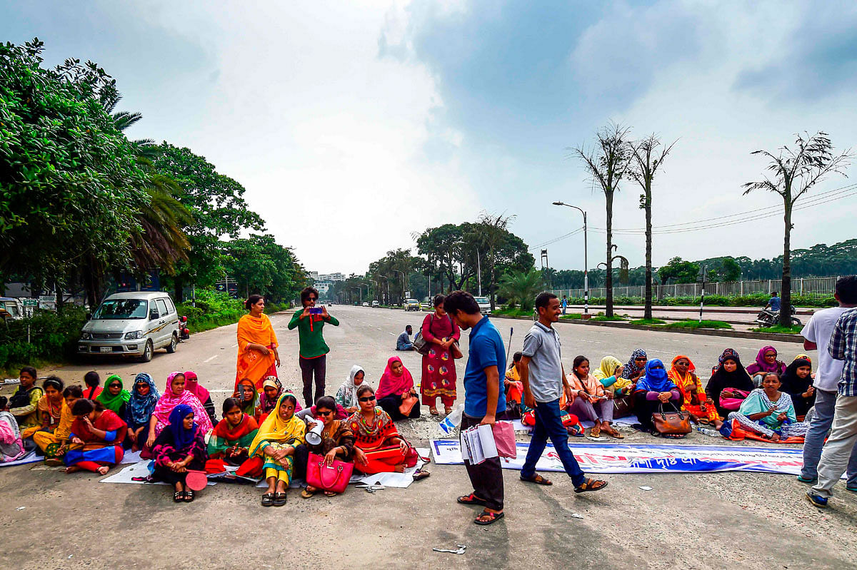 Bangladeshi visually challenged graduate personnel sit to block a road during a protest in front of the National Parliament in Dhaka on 10 July 2019, to request jobs according to their qualification. Photo: AFP