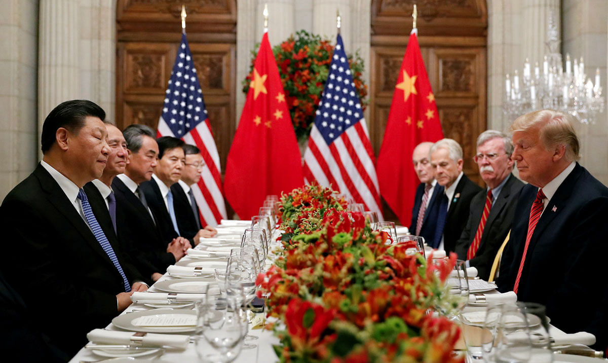 US president Donald Trump, US Secretary of State Mike Pompeo, US president Donald Trump`s national security adviser John Bolton and Chinese president Xi Jinping attend a working dinner after the G20 leaders summit in Buenos Aires, Argentina on 1 December 2018. Reuters File Photo