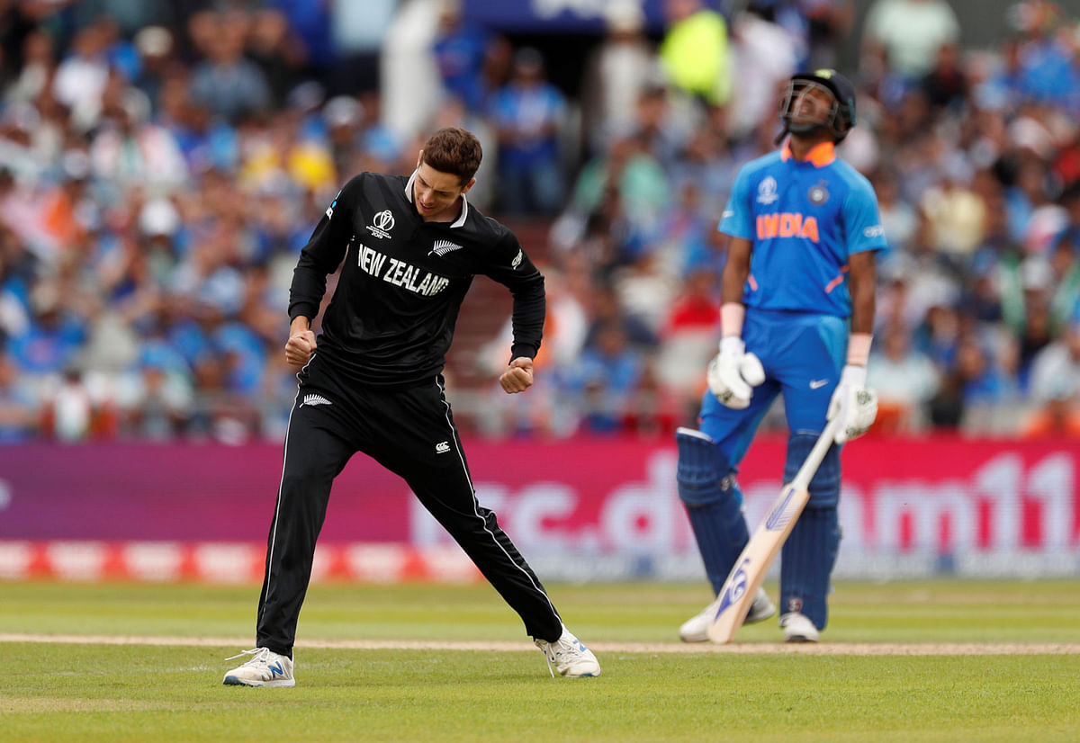 New Zealand`s Mitchell Santner celebrates taking the wicket of India`s Rishabh Pant in the ICC Cricket World Cup Semi-final match against New Zealand at Old Trafford, Manchester, Britain on 10 July 2019. Photo: Reuters