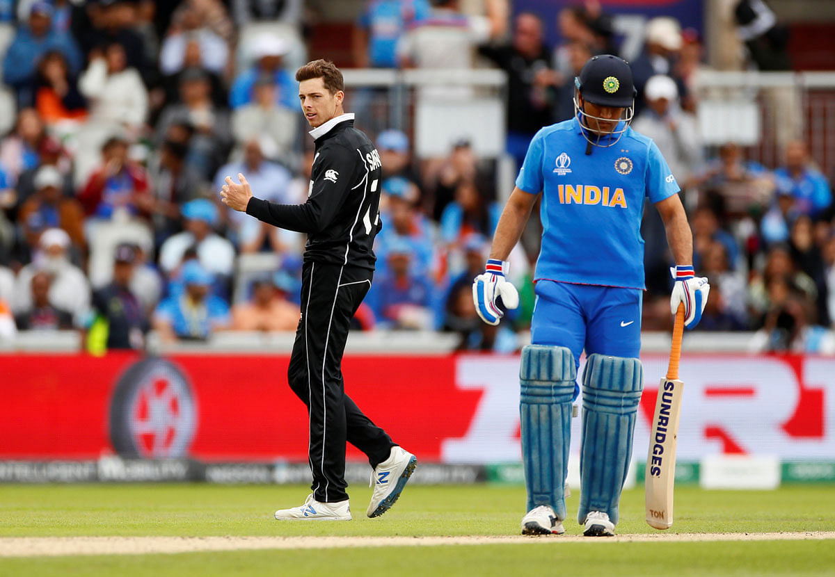 New Zealand`s Mitchell Santner celebrates taking the wicket of India`s Hardik Pandya in the ICC Cricket World Cup Semi-final match against India at Old Trafford, Manchester, Britain on 10 July 2019. Photo: Reuters