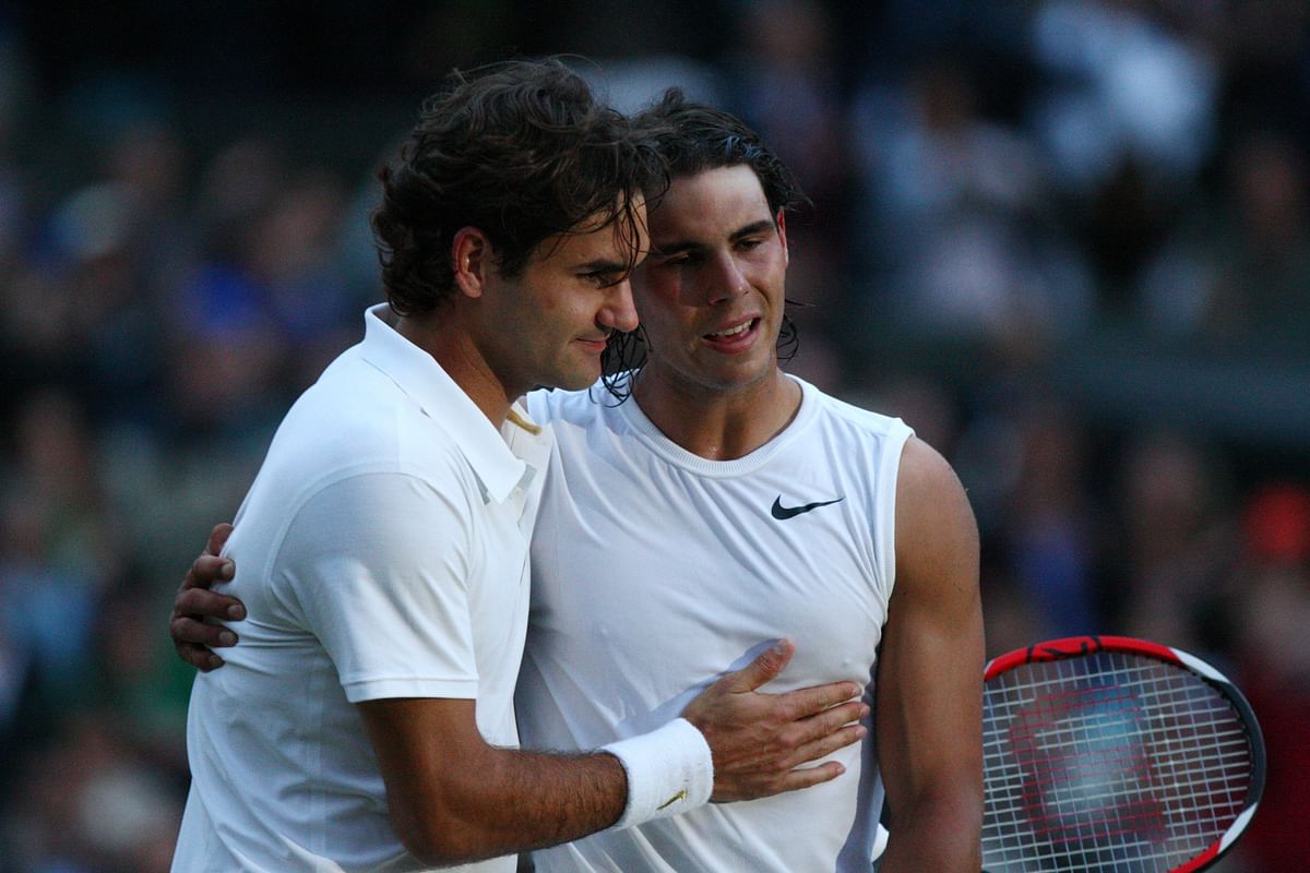 In this file photo taken on 6 July, 2008 Spain's Rafael Nadal (R) is congratulated by Switzerland's Roger Federer after winning their final tennis match of the 2008 Wimbledon championships at The All England Tennis Club in southwest London. Photo: AFP