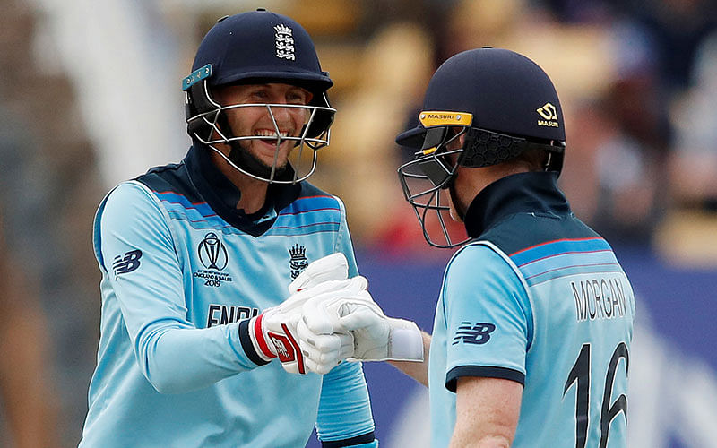 England’s Eoin Morgan and Joe Root celebrate after the ICC Cricket World Cup Semi-final match against England at Edgbaston, Birmingham, Britain on 11 July 2019. Photo: Reuters