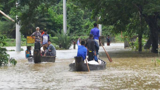 This Bailey bridge in Merung-Longdu road has been submerged for 6 days due to rain, halting vehicular movement. Locals are using boat for communication. Dighinala, Khagrachari, 13 July. Photo: Palash Barua