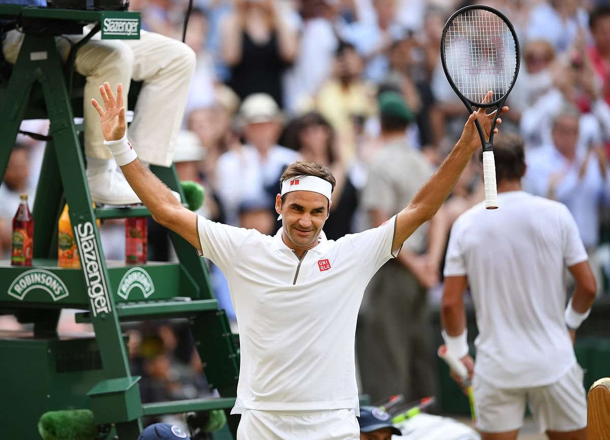 Switzerland`s Roger Federer celebrates beating Spain`s Rafael Nadal during their men`s singles semi-final match on day 11 of the 2019 Wimbledon Championships at The All England Lawn Tennis Club in Wimbledon, southwest London, on 12 July 2019. Photo: AFP