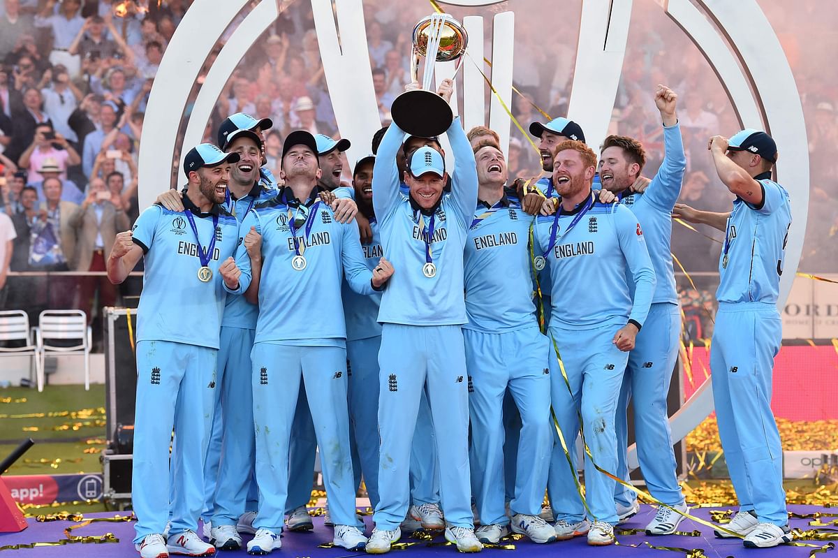 England`s captain Eoin Morgan lifts the World Cup trophy as England`s players celebrate their win after the 2019 Cricket World Cup final between England and New Zealand at Lord`s Cricket Ground in London on July 14, 2019.