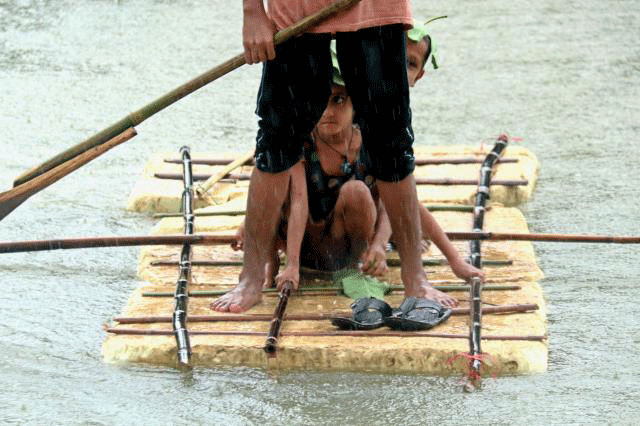 Flood affected people are on a raft at Companiganj upazila of Sylhet on Monday. Photo: Anis Mahmud.