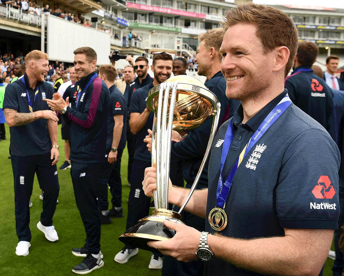 England`s Ben Stokes (L), England`s Chris Woakes (2L), England`s Mark Wood (C) and England`s captain Eoin Morgan attend a World Cup victory event at The Oval in London on 15 July, 2019, a day after they won the 2019 Cricket World Cup final against New Zealand. Photo: AFP