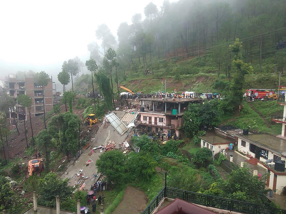Indian rescuers work on a site after a multi-storey building collapsed following heavy rains near Kumarhatti, in Himachal Pradesh’s Solan district on 15 July. Photo: AFP