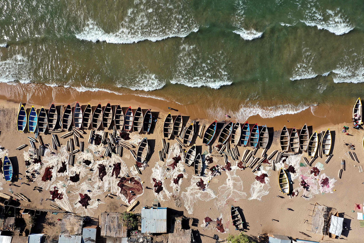 In this aerial view fishing boats are seen on the shore of the Lake Malawi at the Senga village on 20 May 2019 in Senga, Malawi. Hundreds of local traders gather each morning and afternoon at Senga, but fish populations are falling in Lake Malawi, Africa`s third largest body of freshwater. Photo: AFP