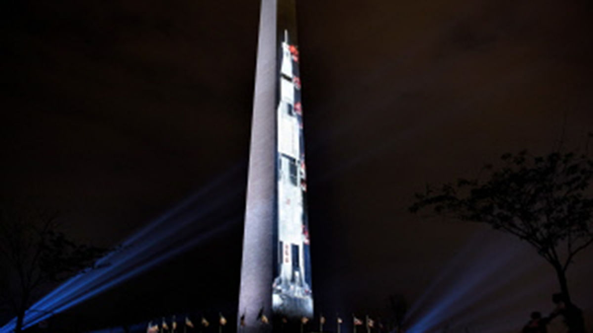 A projection of a Saturn V rocket is seen on the Washington Monument on the National Mall to commemorate the 50th anniversary of NASA’s Apollo 11 mission to the moon 16 July 2019, in Washington, DC. Photo: AFP