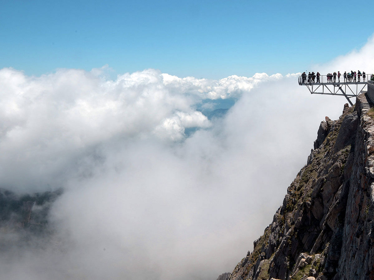 Tourists visit the site of the Pic du Midi Bigorre and astronomical observatory, on 15 July 2019 in La Mongie, Hautes-Pyrenees, France. Photo: AFP