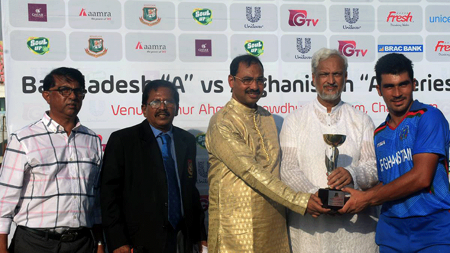 Afghanistan-A team’s opening batsman Rahmanullah Gurbaz receives man of the match award for his unbeaten century. Photo: UNB