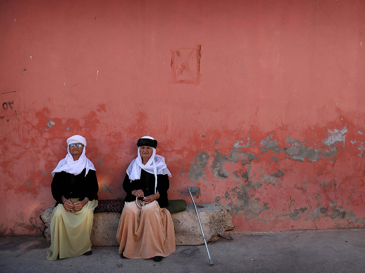 Two elderly Iraqi Yazidi women are pictured in the town of Sheikhan, some 50km northeast of Mosul, on 16 July 2019. Photo: AFP