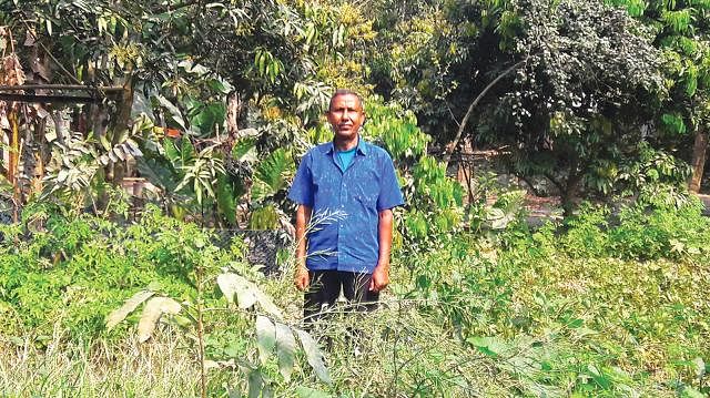 Abdul Mazid poses for camera in his home garden. Photo: Prothom Alo