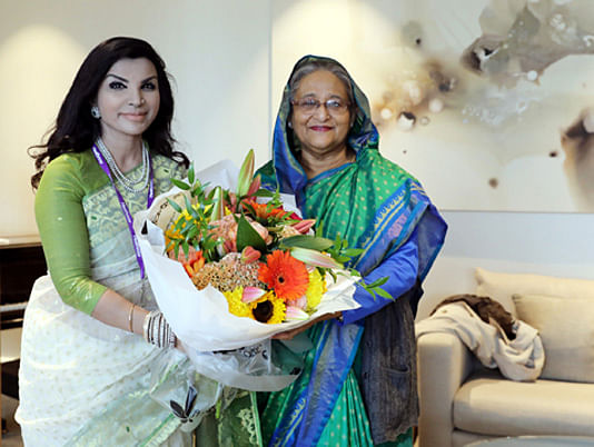 Bangladesh High Commissioner in London Saida Muna Tasneem (L) receives prime minister Sheikh Hasina with a bouquet at Heathrow International Airport, London on Friday. Photo: BSS