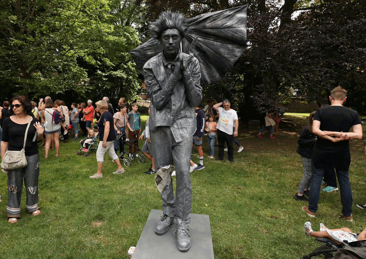 An artist called `Strom Alert` takes part in the festival `Statues en Marche` in Marche-en-Famenne, Belgium, on 20 July 2019. Photo: Reuters
