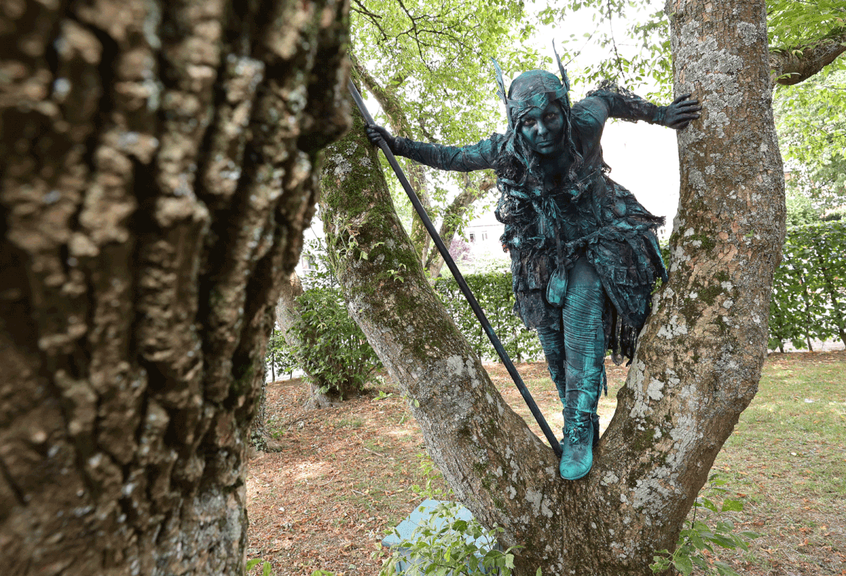 An artist called `Mister Red` takes part in the festival `Statues en Marche` in Marche-en-Famenne, Belgium, on 20 July 2019. Photo: Reuters