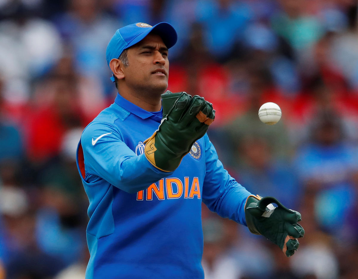 India`s MS Dhoni wearing his new gloves without an emblem on them in the ICC Cricket World Cup match against Australia at The Oval, London, Britain on 9 June 2019. Reuters File Photo