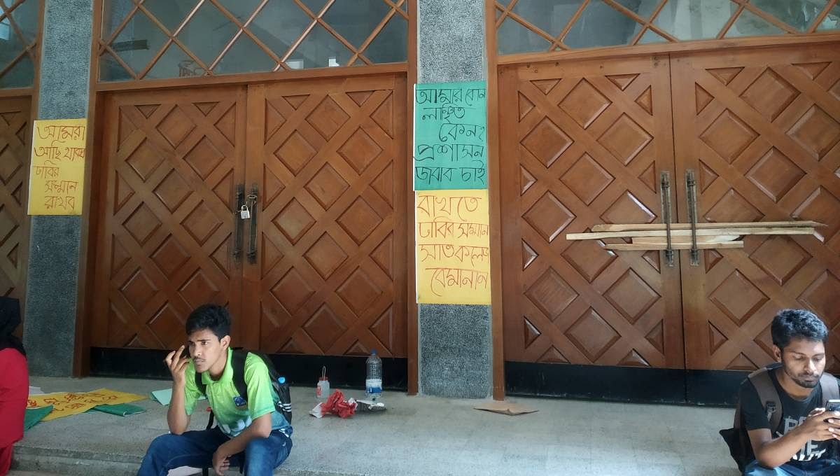 Students of Dhaka University put the academic and the administrative buildings under lock and key on Monday, July 22, 2019. Photo: UNB
