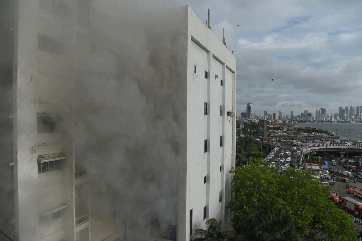 Smoke is seen after a fire broke out in a building in Mumbai on 22 July 2019. Photo: AFP