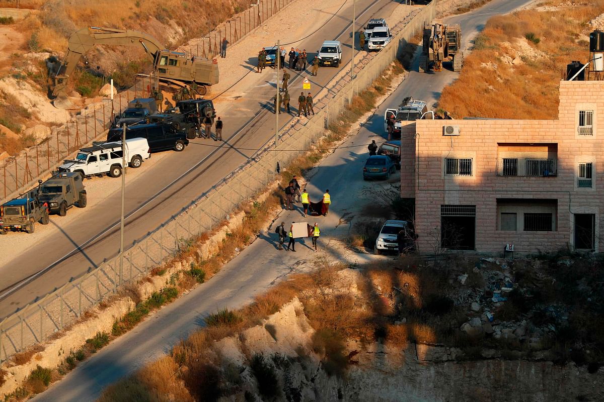 This picture taken on 22 July shows Israeli security forces preparing to demolish the Palestinian buildings still under construction which have been issued notices to be demolished in the Wadi al-Hummus area adjacent to the Palestinian village of Sur Baher in East Jerusalem. Photo: AFP