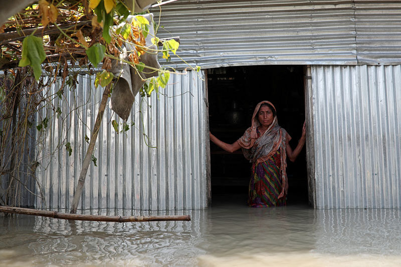 Saju Begum, a flood-affected woman poses for a picture inside her house in Jamalpur, Bangladesh, on 21 July 2019. Photo: Reuters