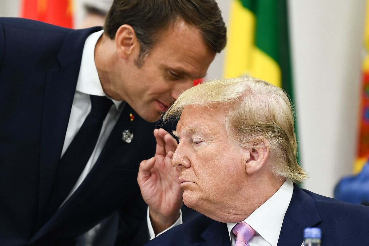 In this file photo taken on 28 June 2019 French president Emmanuel Macron speaks with US president Donald Trump during a meeting at the G20 Summit in Osaka. Photo: AFP