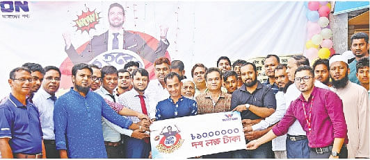 Nazmul Hassan from Cumilla receives a Tk one million check for buying Walton freeze. Walton executive director Humayun Kabir and Rafiqul Islam handed over the check at Cumilla cantonment.