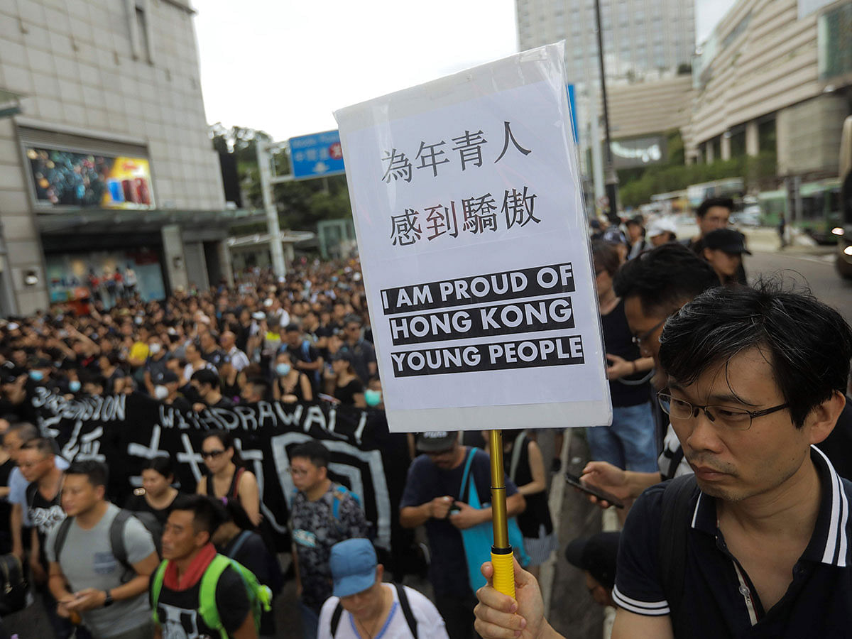 This file photo taken on 7 July 2019 shows protesters marching to the West Kowloon railway station during a demonstration against a proposed extradition bill in Hong Kong. Photo: AFP