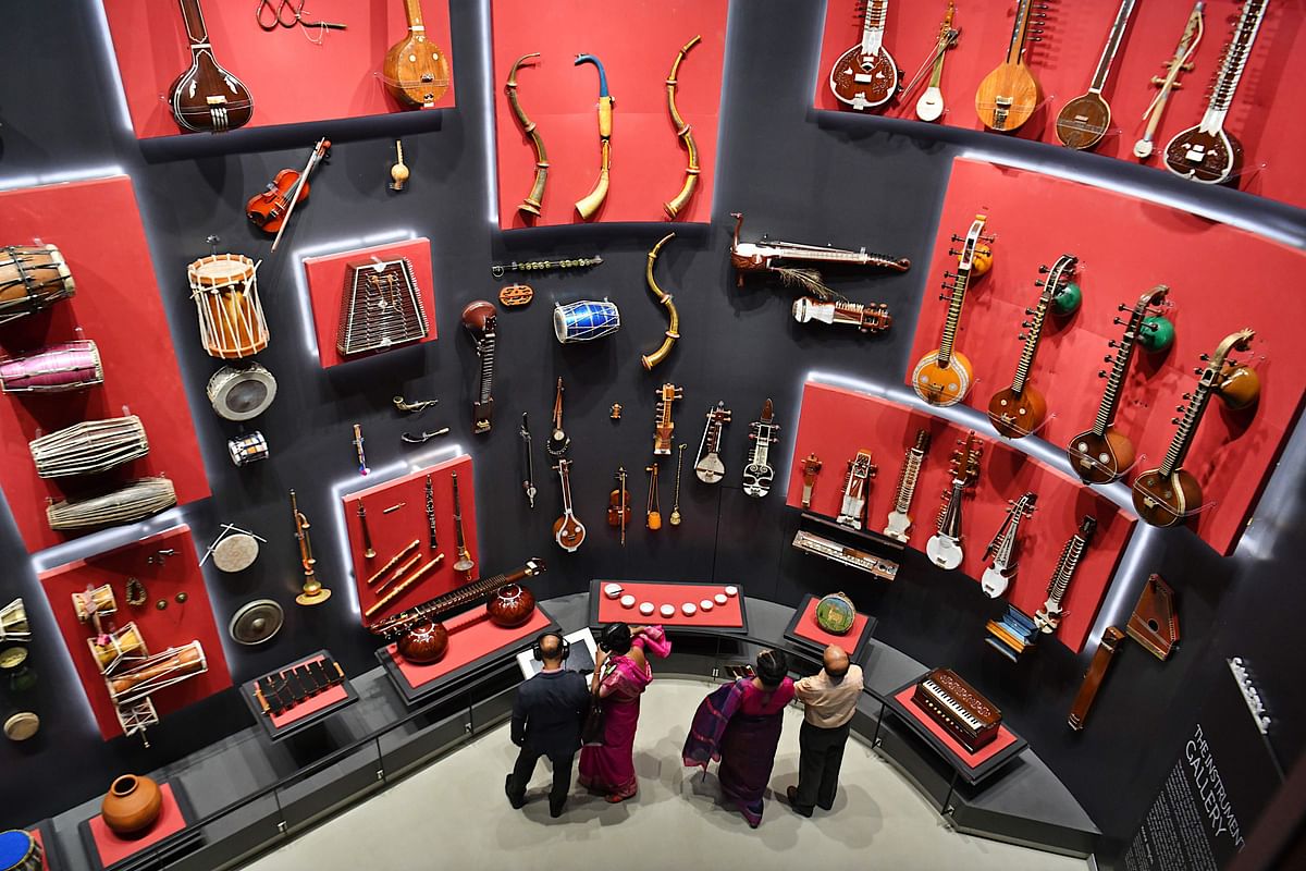 Visitors look at various musical instruments from all over the world at the Indian Music Experience (IME), India’s first interactive music museum, in Bangalore on 27 July 2019. Photo: AFP