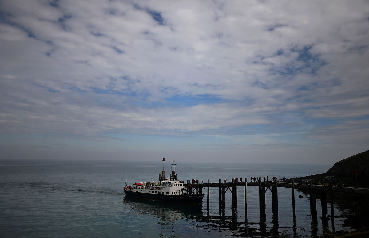 Members of the Cloud Appreciation Society disembark the ferry MS Oldenburg after arriving in Lundy. Photo: Reuters