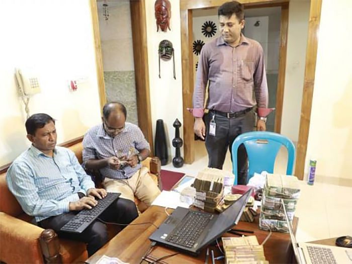 A team of Anti- Corruption Commission (ACC) has seized Tk 8 million from the house of Partha Gopal Banik, deputy inspector general of prisons of Sylhet on 28 July, 2019. Photo: Shuvra Kanti Das