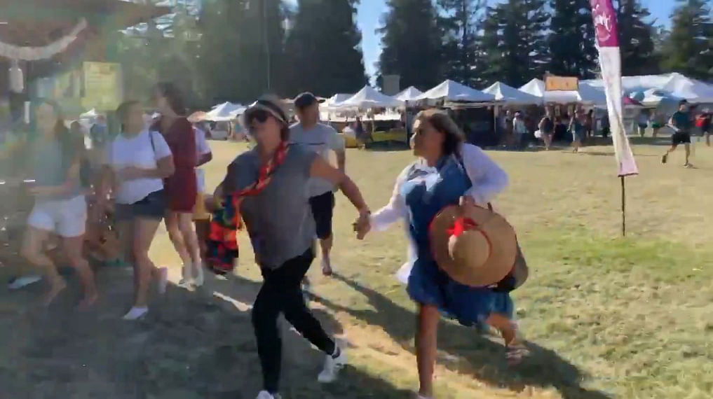 People run as an active shooter was reported at the Gilroy Garlic Festival, south of San Jose, California, US on 28 July in this still image taken from a social media video. Photo: Reuters