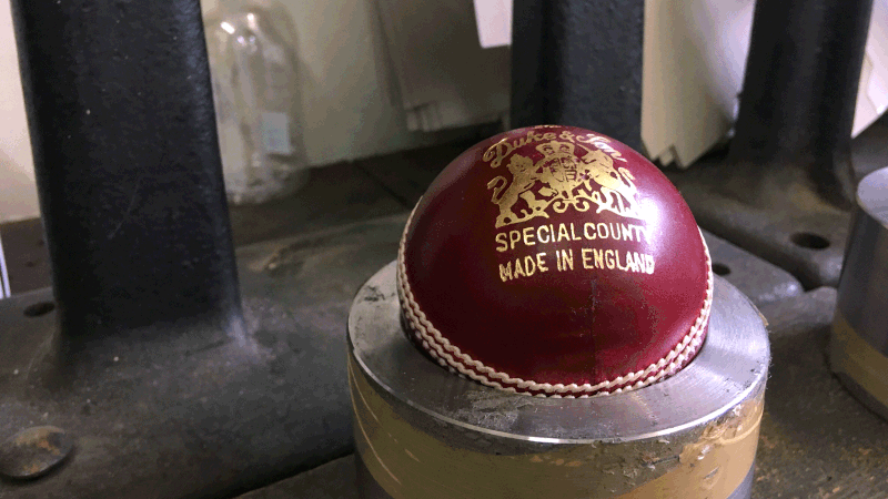 A Dukes ball in the final stage of production at the British Cricket Balls Ltd in Walthamstow, London, Britain on 31 July 2019. Photo: Reuters