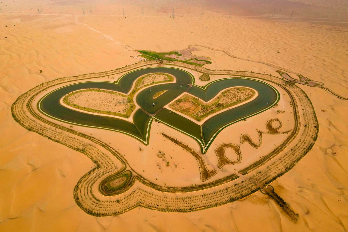 A picture taken with a drone shows the new man-made `Love lake` at al-Qudra desert in the Gulf emirate of Dubai. Photo: AFP