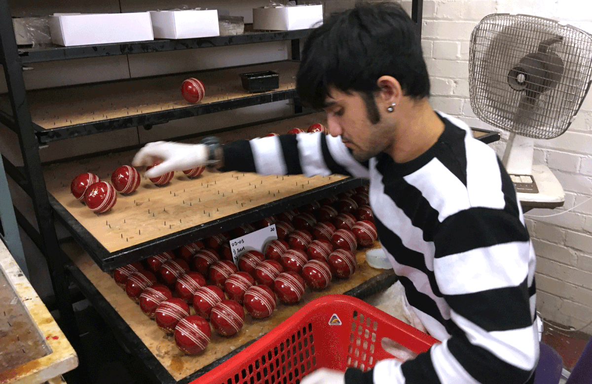 An employee stacks balls at the British Cricket Balls Ltd in Walthamstow, London, Britain on 31 July 2019. Photo: Reuters