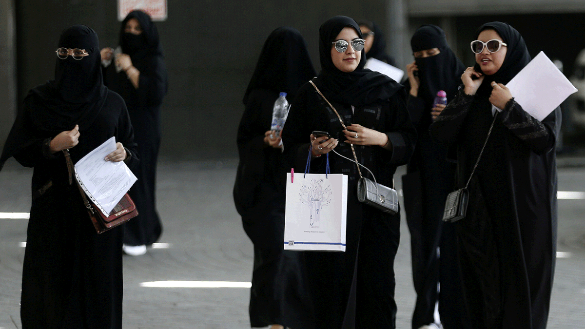 Saudi students walk at the exhibition to guide job seekers at Glowork Women`s Career Fair in Riyadh, Saudi Arabia on 2 October 2018. Photo: Reuters