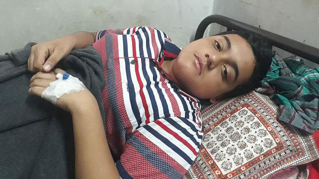 St. Gregory`s High School and College student Ishaq Dhali is suffering from dengue and taking treatment at National Medical College Hospital. Photo: Asaduzzaman