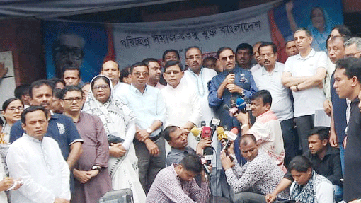 Awami League general secretary and road transport and bridges minister Obaidul Quader a procession in front of the Awami League’s central office at Bangabandhu Avenue marking cleanliness campaign to control dengue outbreak on Friday. Photo: BSS