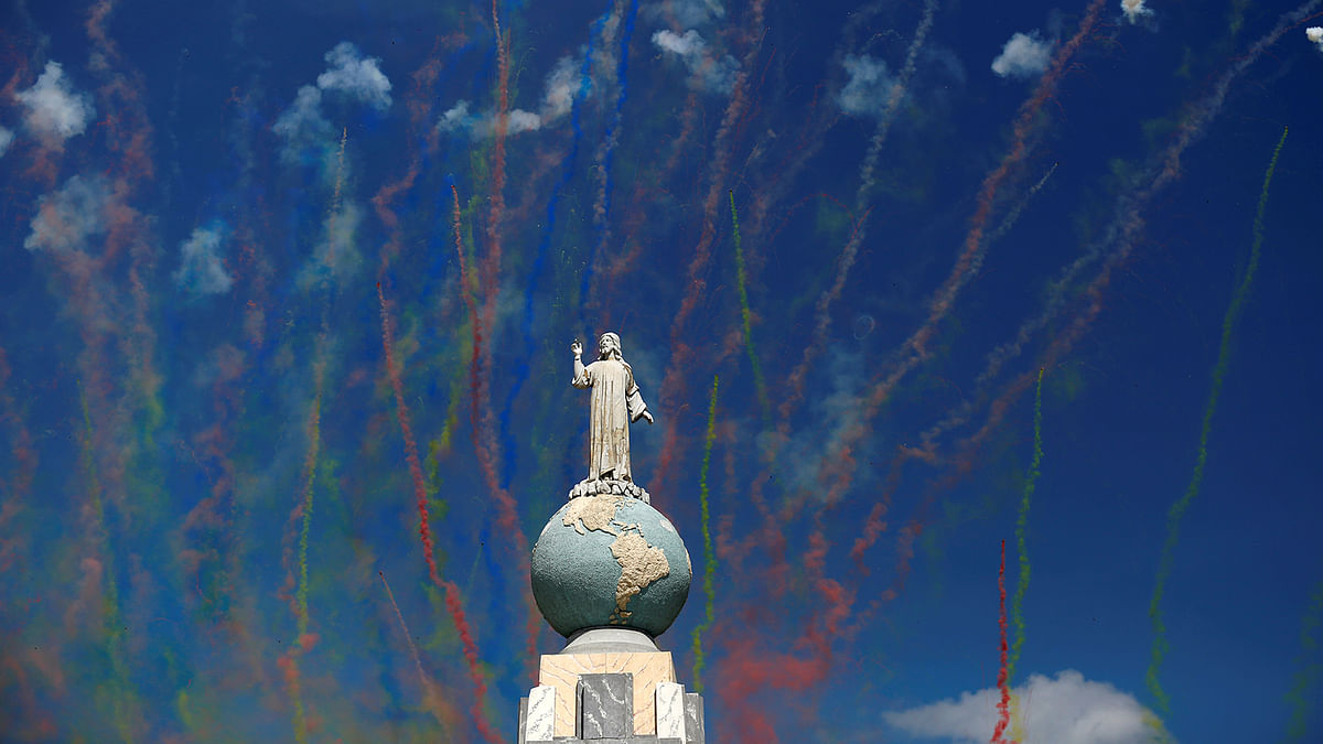 Fireworks are seen behind the monument of El Salvador del Mundo during the opening parade of the festivities of El Divino Salvador del Mundo (The Divine Savior of The World), patron saint of the capital city of San Salvador. Photo: Reuters