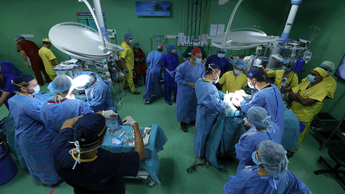 This handout photograph taken early on 2 August 2019 and received from the Action for Defenceless People Foundation (ADPF) shows Hungarian surgeons and medical assistants working to separate conjoined twins Rabeya and Rukaya, at a hospital in Dhaka. Photo: AFP