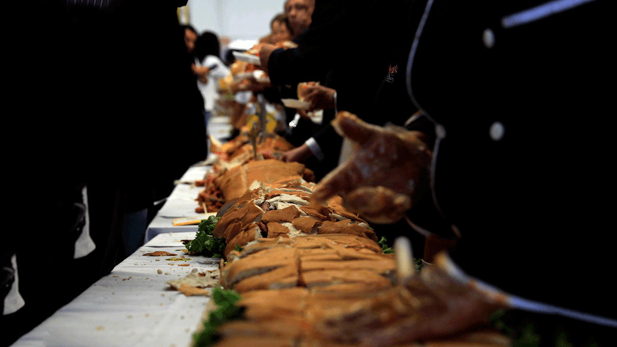 A 72-meter long `torta`, or sandwich, is prepared as an attempt to break the record for the world`s biggest sandwich, in Mexico City. Photo: AFP