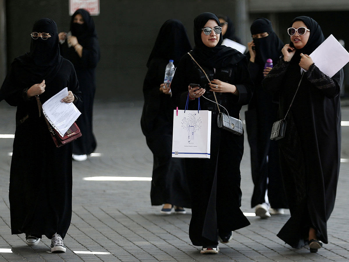 Saudi students walk at the exhibition to guide job seekers at Glowork Women`s Career Fair in Riyadh, Saudi Arabia on 2 October 2018. Reuters File Photo