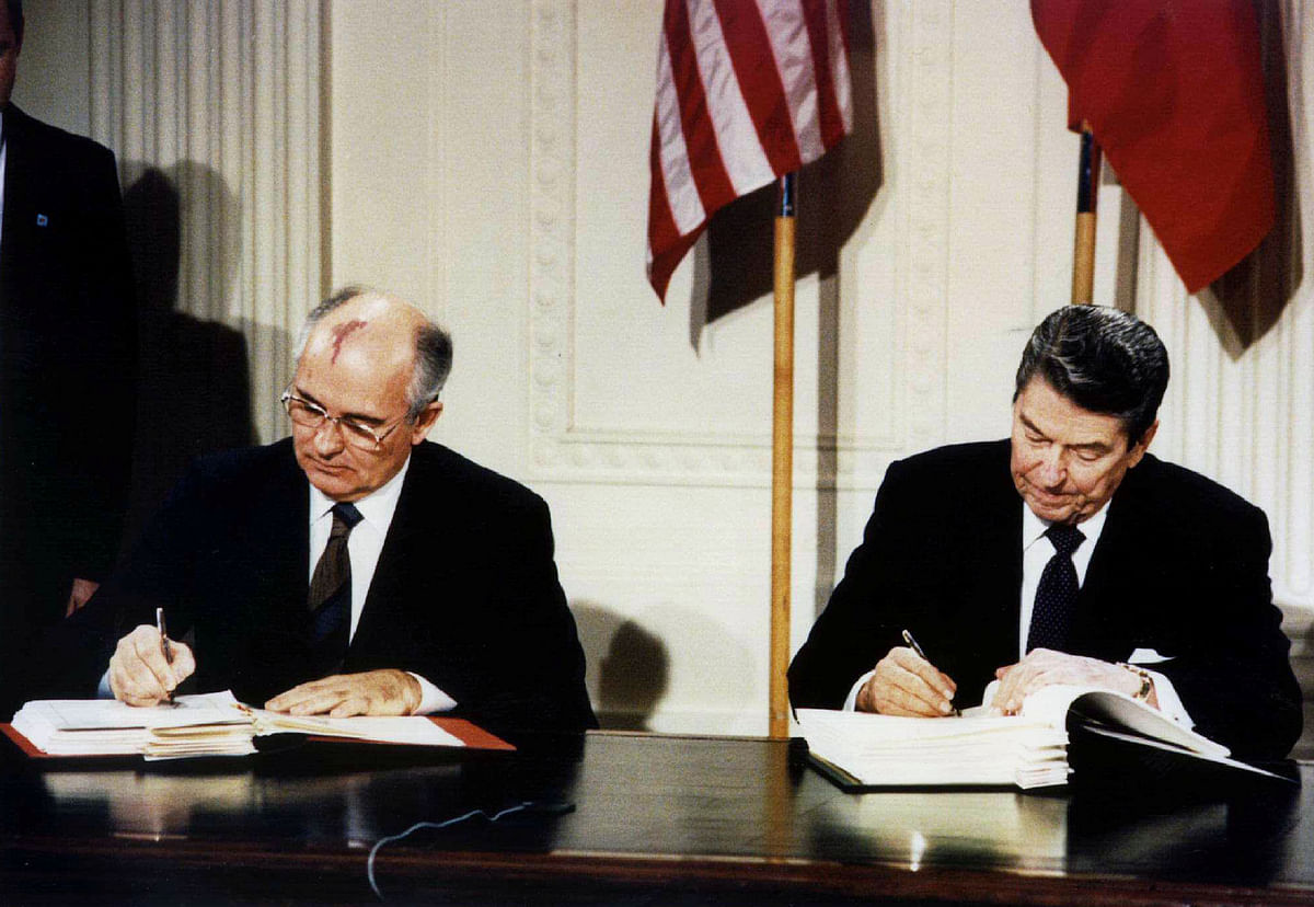 US president Ronald Reagan (R) and Soviet president Mikhail Gorbachev sign the Intermediate-Range Nuclear Forces (INF) treaty in the White House on 8 December 1987. Reuters File Photo