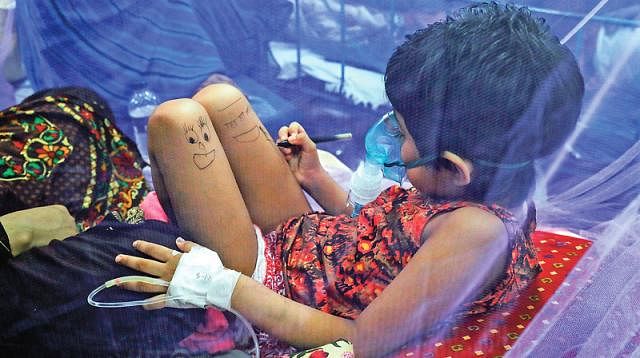 Six-year-old Musnan under treatment at Dhaka Shishu Hospital for nine days. Not she idly draws cartoons on her legs, sitting under the mosquito net to avoid mosquitoes . Prothom Alo File Photo